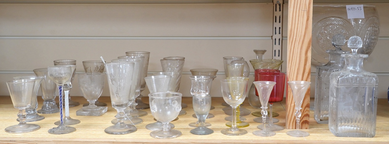 A large cut glass centrepiece, 26cm high, a pair of cut glass decanters and a collection of small glasses from 18th to 20th century. Condition - fair, difficult to see damage as most items need a thorough wash
